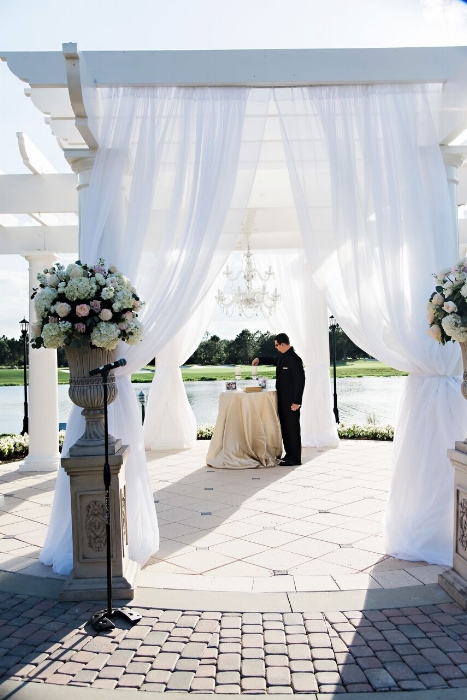 lisa stoner events- aisle decor - ritz cartlon grande lakes - white wedding gazebo- orlando luxury wedding planner - white ceremony flowers.jpg