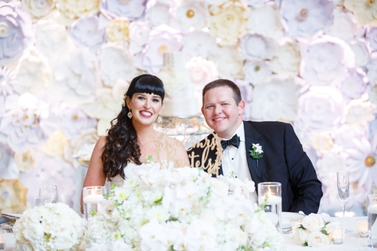 lisa stoner events- bride and groom- white paper flower wall- orlando luxury weddings- bride and groom.jpg