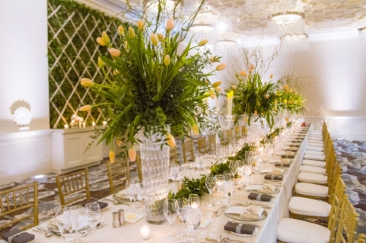 lisa stoner events- luxury central florida weddings- feasting tables- yellow tulip centerpieces - gold chiavari chairs- crystal candelabra.jpg