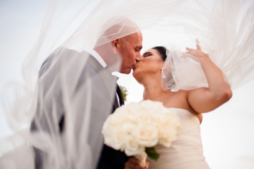 lisa stoner events- white wedding- waldorf astoria orlando wedding-white rose wedding bouquet-first kiss.jpg
