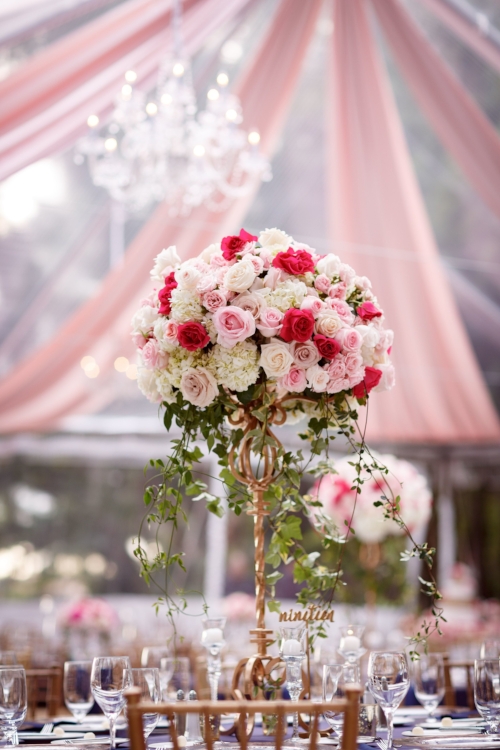 lisa stoner weddings- orlando luxury tented wedding planner- pink tent drape- pink and white tall centerpieces - tented wedding - orlando chic weddings.jpg