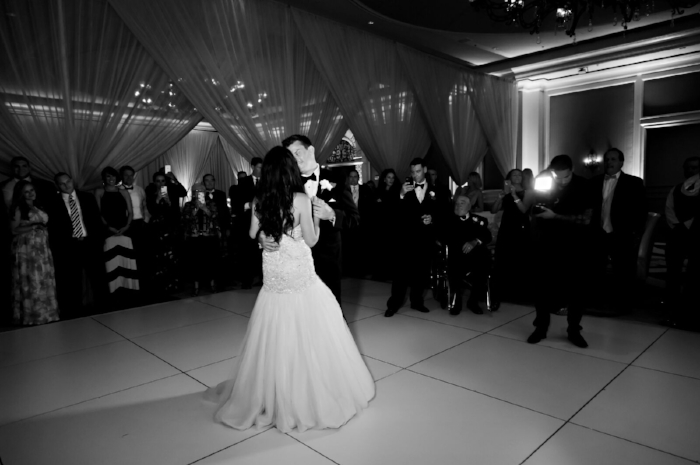 lisa stoner weddings- orlando luxury weddings- white dance floor- black and white wedding photography- draping for a wedding- first dance.jpg